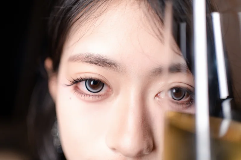 Close study of a model's eyes in warm light